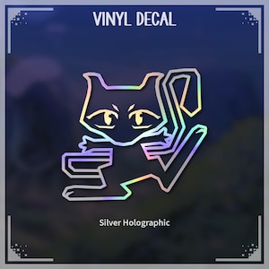 Puede incluir: Una calcomanía de vinilo holográfica plateada de un gato de dibujos animados con una expresión traviesa. La calcomanía presenta el texto "VINYL DECAL" en la parte superior y "Silver Holographic" en la parte inferior.