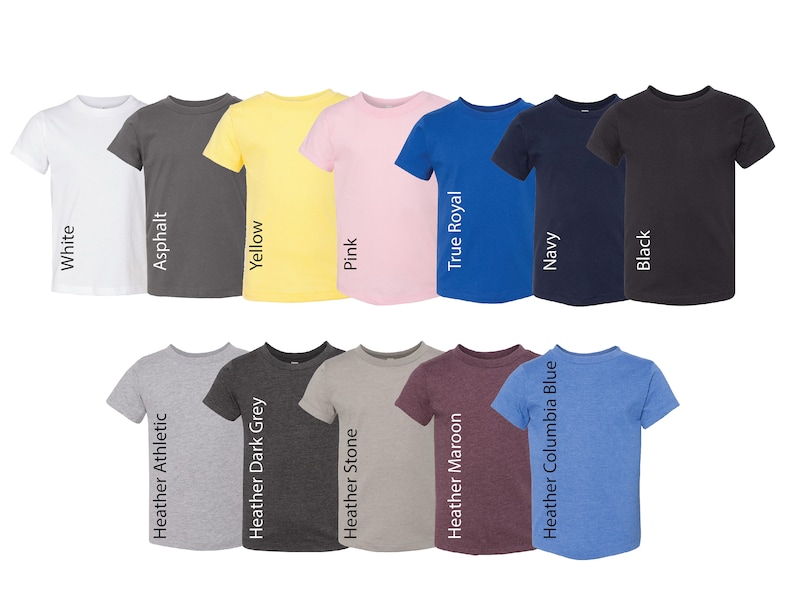 May include: A collection of twelve short-sleeved crew neck t-shirts arranged in two rows. Colors include white, asphalt, yellow, pink, true royal, navy, black, heather athletic, heather dark grey, heather stone, heather maroon, and heather columbia blue.