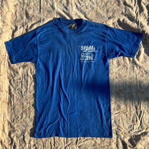 1980s Vintage Single Stitch ‘Skimmers’ Blue Tee Shirt w/ Beaver Graphic “The SFLM Division The Lyons Roar Alpha Mills Corp. Temple, PA”