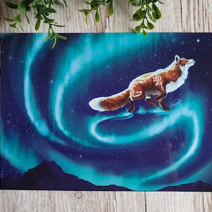 May include: A red fox with white markings on its chest and tail runs across a dark blue sky with swirling green and blue aurora borealis. The fox is looking up at the sky.