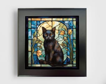 May include: A square black frame containing a stained glass panel featuring a black cat sitting in the center. The background displays a circular yellow moon surrounded by blue glass segments and orange tulip flowers on both sides.