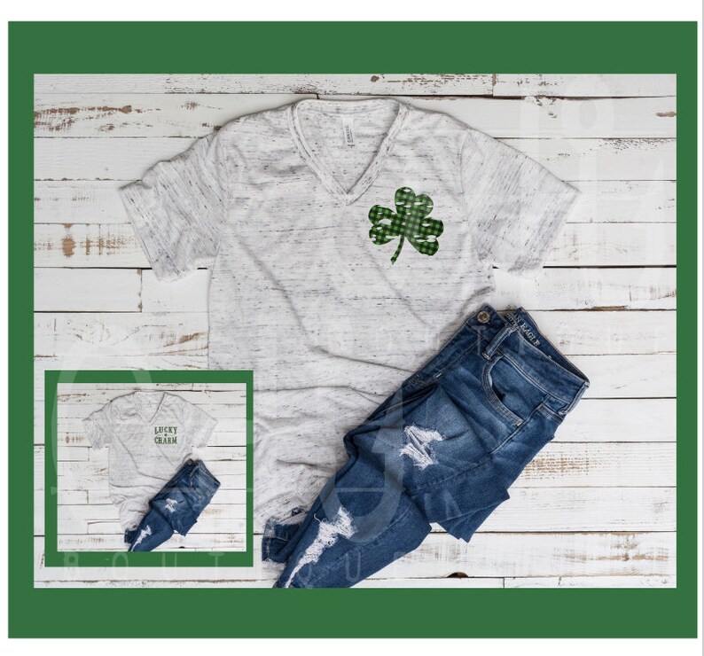 May include: A white t-shirt with a green shamrock design and the text "Lucky Charm" on a white t-shirt. The t-shirt is paired with blue jeans.