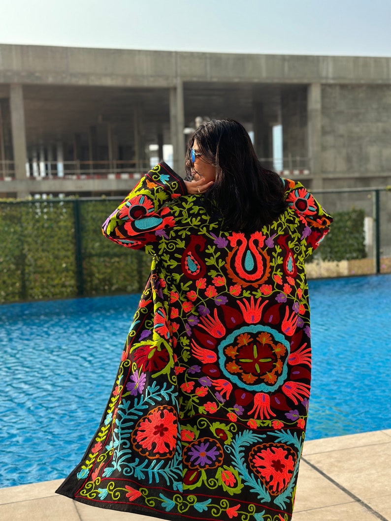 Black long Suzani Embroidered Kimono Coat made by artisans in India for Ornate Handicrafts. Style with jeans t-shirt for  a casual outfit or with a dress for a special party outfit.