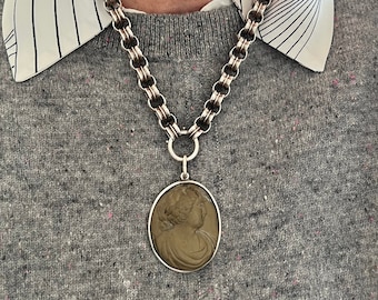 Antique cameo in hand made silver pendant setting