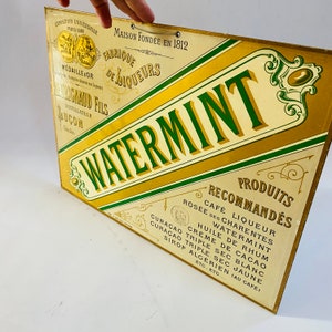 Ancienne enseigne française sur carte publicitaire MENTHE D'EAU Liqueur Bar Fête à manger Or vert noir crème Couleurs de luxe Graphisme Image Maison