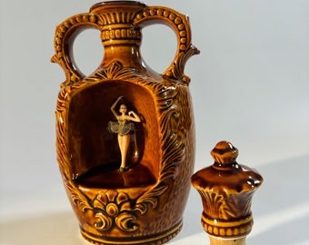 Mid Century Collectable Spinning dancing Ballerina Ochre warm orange brown ceramic Bottle with Knight in Shining Armour- Raise to play