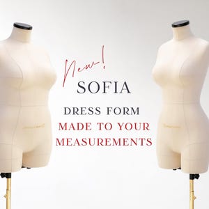 May include: Two beige dress forms with black neck caps and gold stands. The text reads "New! SOFIA DRESS FORM MADE TO YOUR MEASUREMENTS" in red and black font. The dress forms are positioned against a white background.