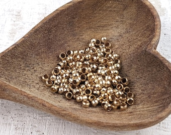 Cuentas de engarce chapadas en oro satinado de 2 mm