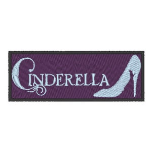 May include: A purple embroidered patch with a white outline and the word "Cinderella" in white cursive lettering. A white glass slipper is embroidered on the right side of the patch.