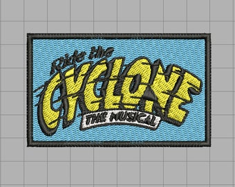 May include: A blue and yellow embroidered patch with the text "Ride the Cyclone: The Musical".
