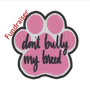 May include: Pink paw print with a white outline and the text "don't bully my breed" in black.