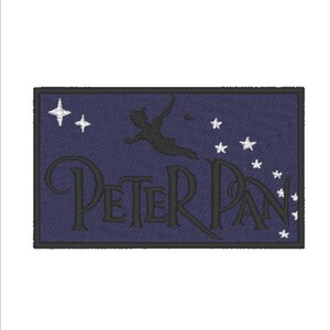 May include: Embroidered patch with a dark blue background featuring a silhouette of Peter Pan flying with a star dust trail. The text "PETER PAN" is embroidered in black below the silhouette. The patch is surrounded by a black border.