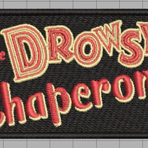 May include: Embroidered patch with the text "The Drowsy Chaperone" in red and cream lettering on a black background.