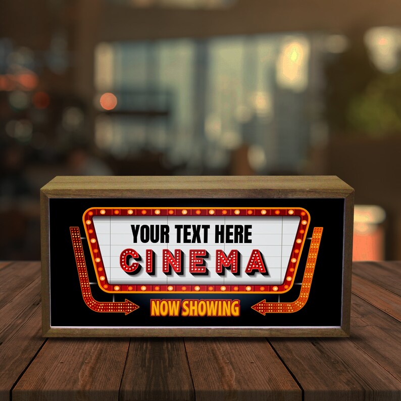 Puede incluir: Una caja de madera con un letrero de estilo marquesina rojo y blanco que dice "YOUR TEXT HERE CINEMA NOW SHOWING".