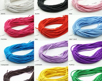 May include: A collection of 12 spools of elastic cord in various colors, including white, black, pink, fuchsia, red, light blue, turquoise, lavender, purple, dark brown, yellow, and green.