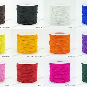May include: A collection of spools of elastic cord in various colors, including chocolate brown, black, white, blue, yellow, golden yellow, orange, purple, pink, red, hot pink, and dark green.