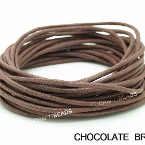 May include: A spool of brown waxed cotton cord. The cord is approximately 1 mm thick and is ideal for jewelry making, crafts, and other projects.