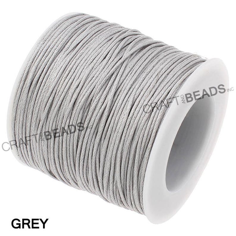 May include: A spool of grey waxed cotton cord, perfect for jewelry making, macrame, and other crafts.