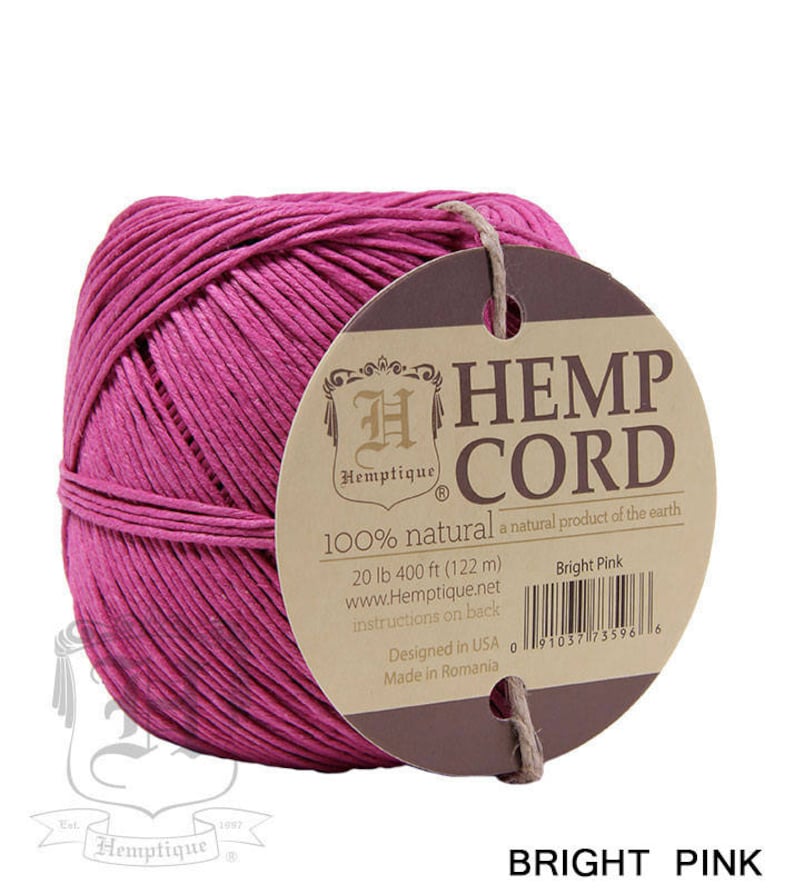 May include: A spool of bright pink hemp cord, 100% natural, with a label that reads "Hemptique Hemp Cord 100% natural a natural product of the earth 20 lb 400 ft (122 m) www.Hemptique.net instructions on back Designed in USA Made in Romania Bright Pink 091037735966"