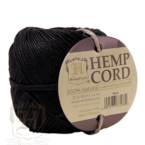 May include: A spool of black hemp cord, labeled "Hemptique Hemp Cord 100% natural a natural product of the earth" with the text "Black" and a barcode. The label also includes the text "20 lb 400 ft (122 m) www.Hemptique.net instructions on back Designed in USA Made in Romania".