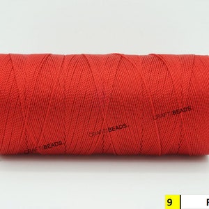 May include: A spool of red waxed cord, labeled "CRAFT BEADS" and "9 Red".