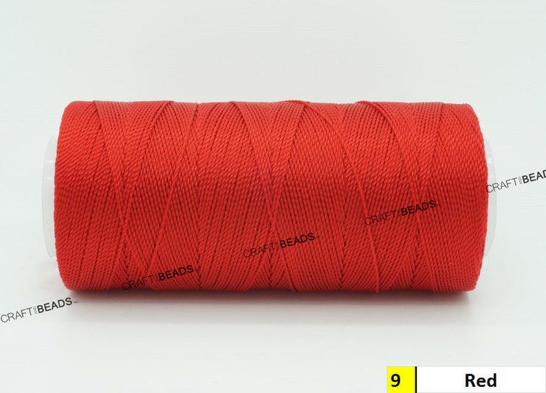 May include: A spool of red waxed cord, labeled "CRAFT BEADS" and "9 Red".