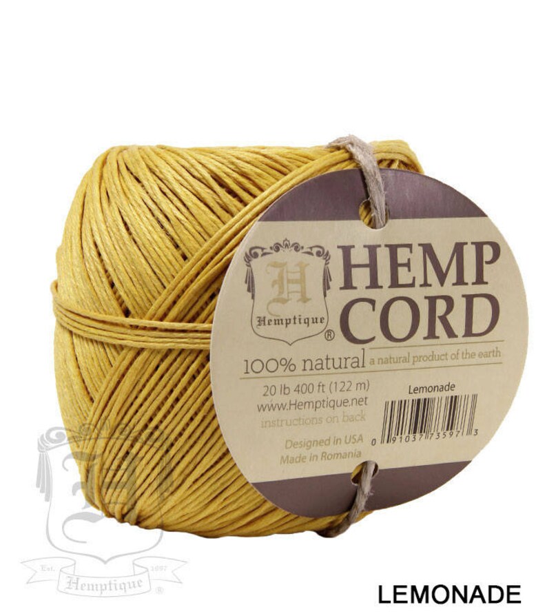 May include: A ball of yellow hemp cord with a brown label that reads "Hemp Cord 100% natural a natural product of the earth 20 lb 400 ft (122 m) www.Hemptique.net instructions on back Lemonade Designed in USA Made in Romania 0 91037735973"