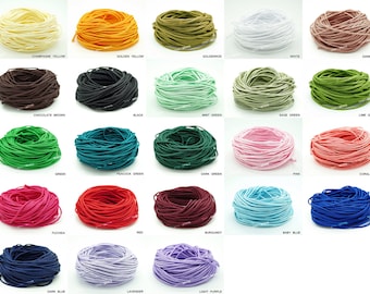 May include: A variety of colors of elastic cord, wound into coils. The colors include champagne yellow, golden yellow, goldenrod, white, dark tan, chocolate brown, black, mint green, sage green, lime green, green, peacock green, dark green, pink, coral pink, fuchsia, red, burgundy, baby blue, blue, dark blue, lavender, and light purple.