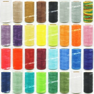 May include: Assortment of 24 spools of waxed leather cord in various colors, including red, blue, green, yellow, orange, brown, black, white, and purple. The spools are arranged in a grid pattern.