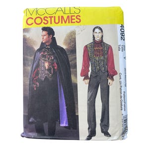May include: A McCall's Costumes pattern packet featuring a vampire costume. The package shows a man in a black cape with a purple lining, a ruffled shirt, and a vest. The text "McCall's Costumes" is at the top.