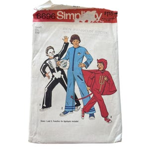 May include: Vintage Simplicity sewing pattern 6696 for children's Halloween costumes. The pattern includes instructions for a skeleton, astronaut, and devil costume. The package is labeled "Small 4-6 Boy."