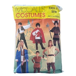 May include: A package of McCall's Costumes sewing patterns. The package features illustrations of children in various historical costumes, including a knight, a Viking, and a medieval figure. The text "EASY SEW" is visible.