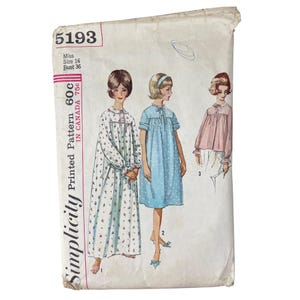 May include: Vintage Simplicity printed pattern envelope. The envelope features illustrations of three different nightgown designs. The designs include a long floral nightgown, a blue polka-dot nightgown, and a pink top with white pants. The envelope has the number 5193.