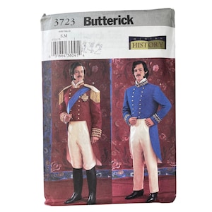 May include: A Butterick sewing pattern featuring illustrations of historical military-style jackets and trousers. The pattern includes a red jacket with gold accents and a blue jacket with gold buttons. The pattern is labeled "3723" and "Making History."