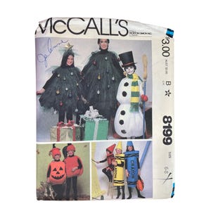 May include: McCall's sewing pattern featuring costumes. The image shows a Christmas tree costume, a snowman costume, a pumpkin costume, and crayon costumes. The pattern is for sizes 6-8.