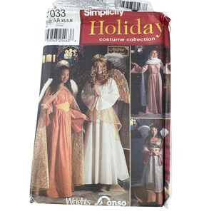 May include: Simplicity Holiday costume collection pattern. The package features images of angel costumes in various styles. The main image shows two women in angel costumes with wings. The package includes the size AA XS, S, and M.