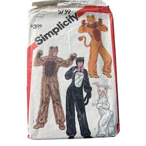 May include: Vintage Simplicity sewing pattern featuring animal costumes. The pattern includes instructions for a bear, cat, lion, and bunny costume. The package is white with red accents and the Simplicity logo.
