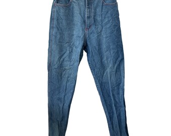 May include: A pair of blue denim jeans with a high waist and a button fly.