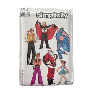 May include: A Simplicity sewing pattern envelope featuring illustrations of various costume designs. The costumes include a pirate, a vampire with a red cape, a Santa Claus, a belly dancer, a genie, and a ballerina. The envelope is white with black text.