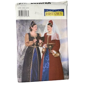 May include: A Butterick sewing pattern for historical costumes, featuring two women in Renaissance-style dresses. The pattern includes sizes 16W-18W-20W. The cover displays the "Making History" logo and the pattern number 6197.