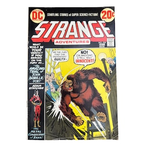 May include: A vintage comic book cover for "Strange Adventures" featuring a large gorilla, the text "The Amazing Trial of John Gorilla Doe!", and the words "Innocent!" in a speech bubble. The cover is in black, red, yellow, and white.