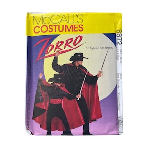 May include: A McCall's Costumes sewing pattern for a Zorro costume. The package features a graphic of Zorro in a black outfit with a red cape, holding a sword. The text reads "Zorro...the legend continues."