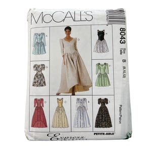 May include: A McCall's sewing pattern envelope featuring illustrations of various formal dresses. The envelope is white with the McCall's logo and the number 8043. The size is B (8,10,12). The words "Express Yourself" are also visible.