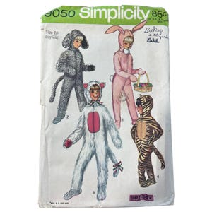 May include: Vintage Simplicity sewing pattern featuring children's animal costumes. The pattern includes instructions for a dog, bunny, cat, and tiger costume. The pattern is size 10, for boy or girl. The pattern's original price was 85 cents.