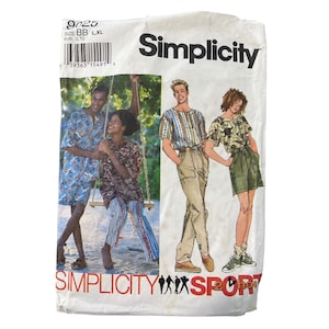 May include: A vintage Simplicity sewing pattern envelope. The envelope features illustrations of people wearing various outfits, including shorts, pants, and a skirt. The Simplicity logo is prominently displayed, along with the text "Sport".