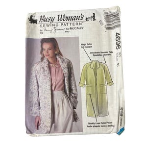 May include: A vintage sewing pattern titled "Busy Woman's Sewing Pattern" by Nancy Zieman for McCall's. The pattern features a coat design with a magic collar and detachable shoulder pads. The size is 16.