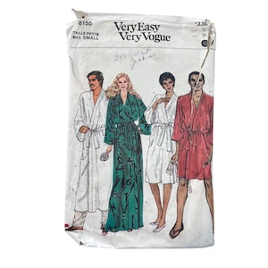 May include: A Very Easy Very Vogue sewing pattern envelope, number 8155, size small. The white paper envelope features illustrations of four individuals wearing various styles of robes in white, green with black patterns, and red.