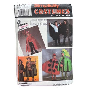May include: A vintage Simplicity Costumes pattern packet featuring illustrations of children in various Halloween costumes. The packet includes images of a devil, a medieval archer, a ladybug, and a dragon. The pattern is size A (S-M-L-G).