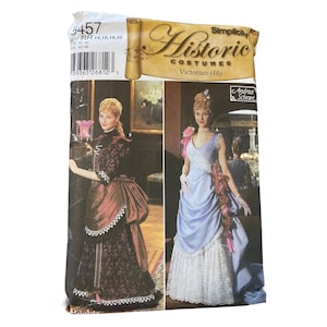 May include: Simplicity Historic Costumes pattern for Victorian 1880 dresses. The package features two women in period gowns, one in burgundy and the other in light blue. The pattern includes sizes 14, 16, 18, and 20.