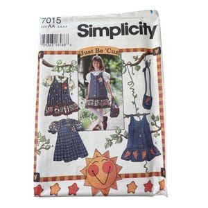 May include: Simplicity sewing pattern featuring a girl's dress with a star and floral design. The pattern includes the text "Just Be 'Cuz" and the size is AA 3,4,5,6. The dress has a blue and white color scheme.